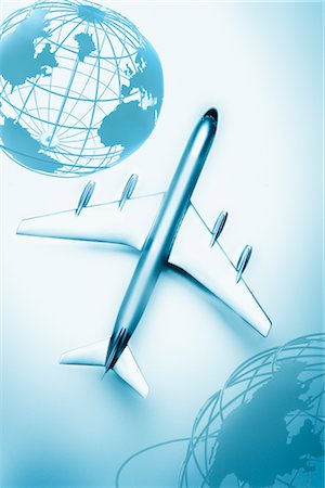 photo of wire frame of the world - Boeing 707 Model Airplane and Globes Stock Photo - Premium Royalty-Free, Code: 600-02738004