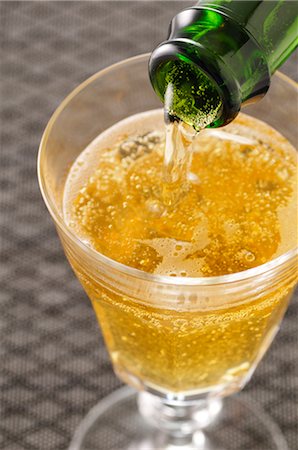 simsearch:600-02912202,k - Champagne Pouring into Glass Stock Photo - Premium Royalty-Free, Code: 600-02756486