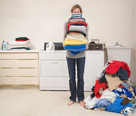 Woman Doing the Laundry Stock Photo - Premium Royalty-Free, Code: 600-02757058