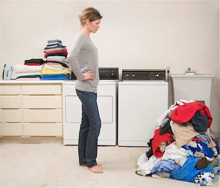 Woman Doing the Laundry Stock Photo - Premium Royalty-Free, Code: 600-02757059