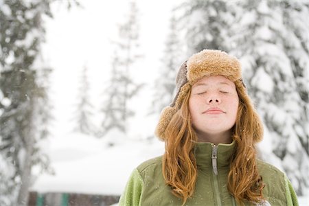 snowflakes - Girl Outdoors During Snowfall Stock Photo - Premium Royalty-Free, Code: 600-02757050