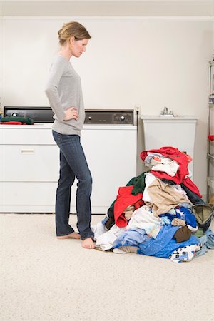 Woman Doing the Laundry Stock Photo - Premium Royalty-Free, Code: 600-02757062