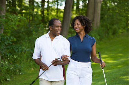 picture of people walking and chatting - Couple Walking on Golf Course Stock Photo - Premium Royalty-Free, Code: 600-02751461