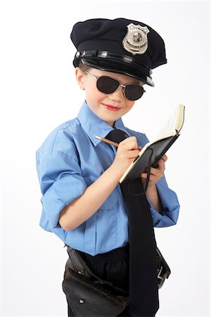 Girl Dressed as Police Officer Stock Photo - Premium Royalty-Free, Code: 600-02786828
