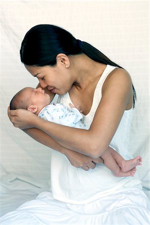 Mother Holding Sleeping Newborn Baby Stock Photo - Premium Royalty-Free, Code: 600-02833976