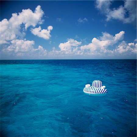 simsearch:600-02886000,k - Seascape, Floating Inflatable Chair Stock Photo - Premium Royalty-Free, Code: 600-02885976