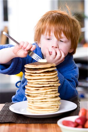 simsearch:600-05653250,k - Little Boy Eating a Stack of Pancakes Stock Photo - Premium Royalty-Free, Code: 600-02883075