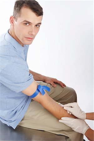 simsearch:600-02912811,k - Patient Getting a Needle Stock Photo - Premium Royalty-Free, Code: 600-02912802