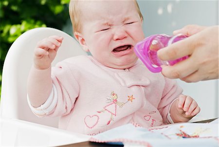 Crying Baby in High Chair Stock Photo - Premium Royalty-Free, Code: 600-03004386