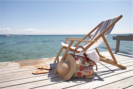 flips flops - Chair, Hat, Flip Flops and Bag on Dock Stock Photo - Premium Royalty-Free, Code: 600-03017288