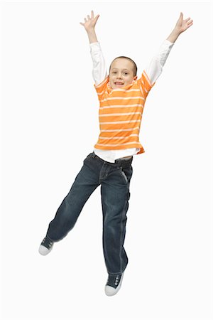 Boy Jumping in Studio Stock Photo - Premium Royalty-Free, Code: 600-03017565
