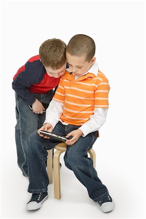 Boys with Handheld Video Game Stock Photo - Premium Royalty-Free, Code: 600-03017561