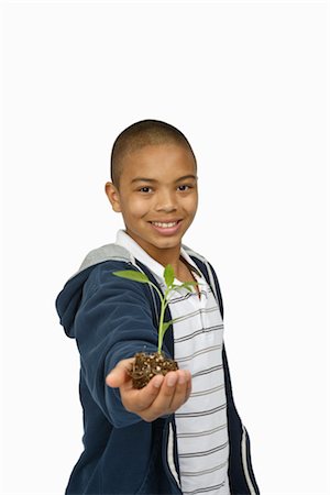 Boy Holding Sapling Stock Photo - Premium Royalty-Free, Code: 600-03017573