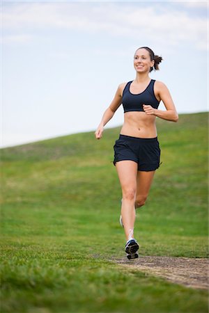 Woman Running in Park, Seattle, Washington, USA Stock Photo - Premium Royalty-Free, Code: 600-03017921