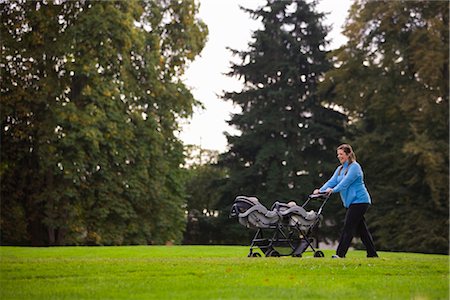 Woman Pushing Stroller in Park, Seattle, Washington, USA Stock Photo - Premium Royalty-Free, Code: 600-03017964