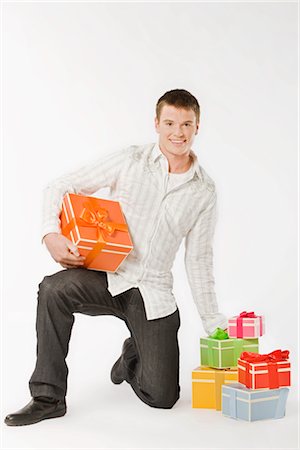 simsearch:649-08085108,k - Man Holding Gifts Stock Photo - Premium Royalty-Free, Code: 600-03075116