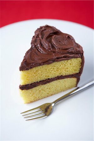 Slice of Cake with Chocolate Icing Stock Photo - Premium Royalty-Free, Code: 600-03194970