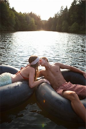 female inflatable ring - Young Couple Floating on Inner Tubes on the Lake, Near Portland, Oregon, USA Stock Photo - Premium Royalty-Free, Code: 600-03210550