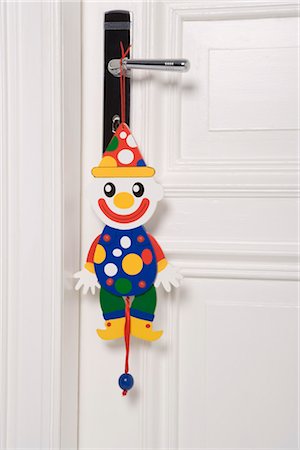 Clown Marionette Hanging From Door Handle Stock Photo - Premium Royalty-Free, Code: 600-03298887