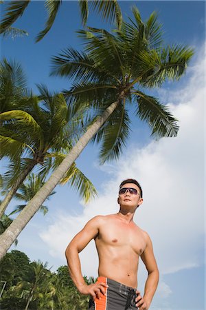 simsearch:600-03333357,k - Man with Hands on Hips at Beach Stock Photo - Premium Royalty-Free, Code: 600-03333271