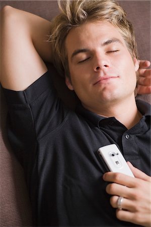 Man Napping with Cell Phone Stock Photo - Premium Royalty-Free, Code: 600-03333338
