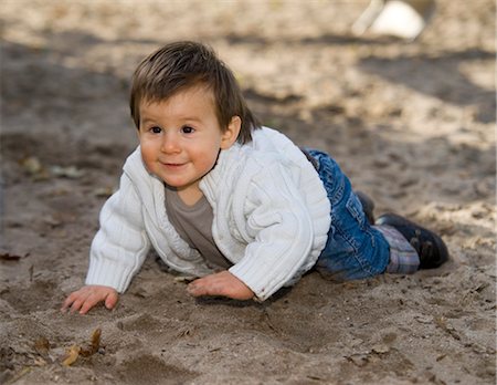 Boy Crawling in Sand Stock Photo - Premium Royalty-Free, Code: 600-03456212
