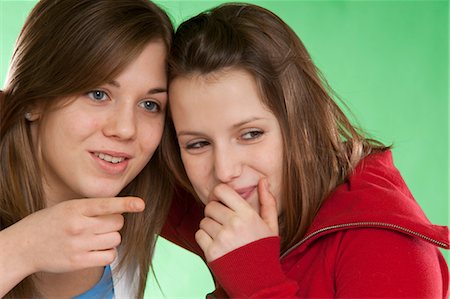 simsearch:600-03456226,k - Two Friends Telling a Secret Stock Photo - Premium Royalty-Free, Code: 600-03456226