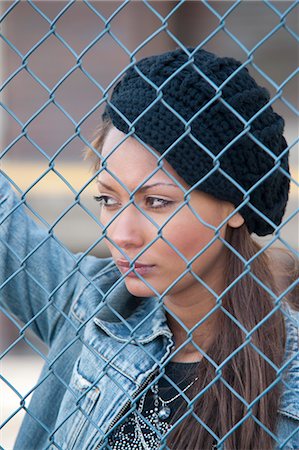 simsearch:700-06701841,k - Portrait of Woman behind Fence Stock Photo - Premium Royalty-Free, Code: 600-03456836