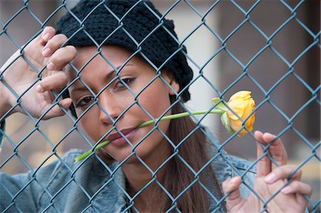 simsearch:700-03290294,k - Portrait of Woman behind Fence Stock Photo - Premium Royalty-Free, Code: 600-03456839