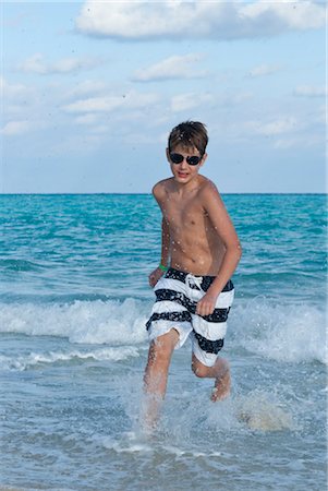 Boy by Surf, Playa del Carmen, Yucatan Peninsula, Mexico Stock Photo - Premium Royalty-Free, Code: 600-03456888