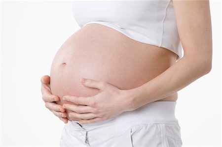 female belly expansion - Close-up of Pregnant Woman's Belly Stock Photo - Premium Royalty-Free, Code: 600-03451336