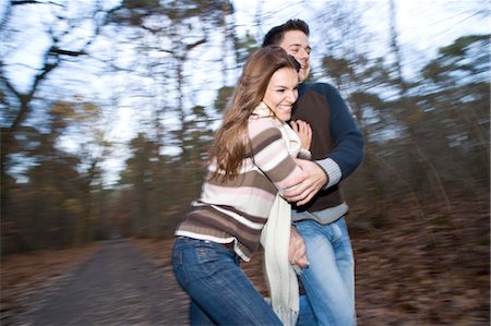 panning (camera technique) - Couple in Forest Stock Photo - Premium Royalty-Free, Code: 600-03451489