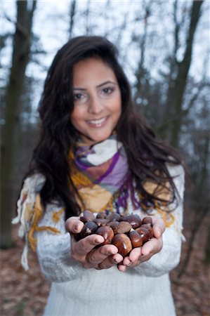 simsearch:600-03768654,k - Woman With a Handful of Chestnuts Stock Photo - Premium Royalty-Free, Code: 600-03451502