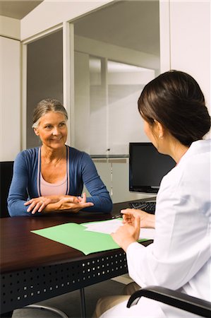 senior woman and doctor and two people - Woman Talking to Doctor Stock Photo - Premium Royalty-Free, Code: 600-03503185