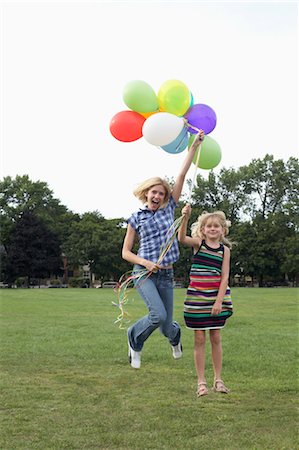 Mother and Daughter with Balloons Stock Photo - Premium Royalty-Free, Code: 600-03601500