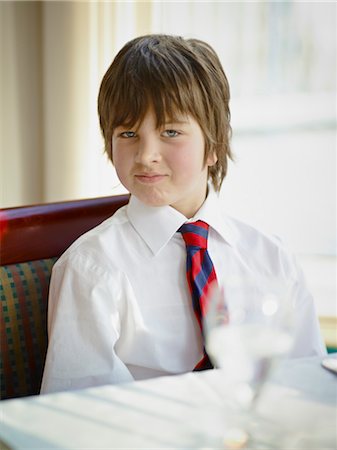 fancy restaurant - Boy wearing Shirt and Tie in Restaurant Stock Photo - Premium Royalty-Free, Code: 600-03621305