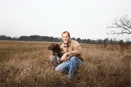 Portrait of Man and Dog, Houston, Texas, USA Stock Photo - Premium Royalty-Free, Code: 600-03644806