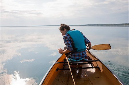 Woman Canoeing, Clearwater Lake, Clearwater Lake Provincial Park, Manitoba, Canada Stock Photo - Premium Royalty-Free, Code: 600-03641263