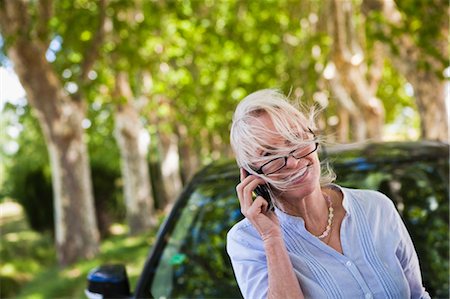 Woman Talking on iPhone, France Stock Photo - Premium Royalty-Free, Code: 600-03654643