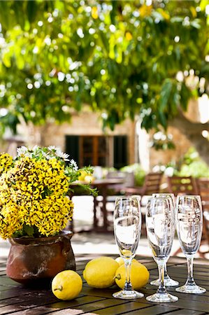 Close-up of Champagne Glasses and Lemons on Table, Majorca, Spain Stock Photo - Premium Royalty-Free, Code: 600-03682293