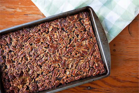 Pan of Gluten-free Pecan Pie Squares Cooling on the Table, Vancouver, British Columbia, Canada Stock Photo - Premium Royalty-Free, Code: 600-03698377