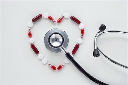 Pills in Heart Shape with Stethoscope Stock Photo - Premium Royalty-Free, Code: 600-03738145