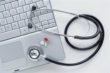 shopping and still life - Laptop Computer with Stethoscope and Pills Stock Photo - Premium Royalty-Free, Code: 600-03738147