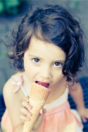 eating ice cream - Girl Eating Ice Cream Cone Stock Photo - Premium Royalty-Free, Code: 600-03738450