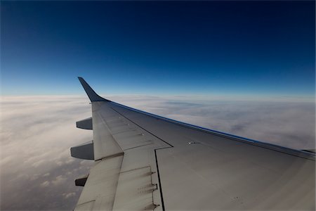 fly clouds - Airplane Wing in Flight Stock Photo - Premium Royalty-Free, Code: 600-03738474