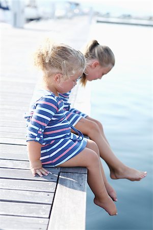 family photo on a dock - Girls Sitting on edge of Dock Stock Photo - Premium Royalty-Free, Code: 600-03738704