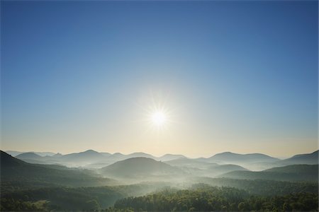 pictures of natures sunrise in hill - Sun over Mountains, Vorderweidenthal, Pfalzerwald, Rhineland-Palatinate, Germany Stock Photo - Premium Royalty-Free, Code: 600-03762485