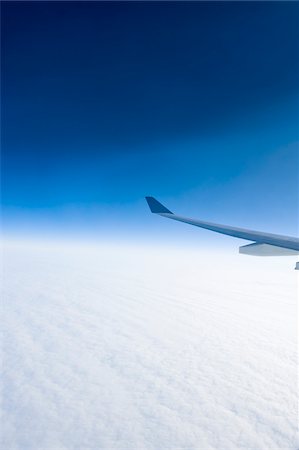 plane and sky - Airplane Wing over Clouds with Blue Sky, Salzburg, Austria Stock Photo - Premium Royalty-Free, Code: 600-03783337