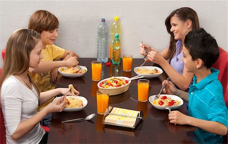 Children Eating Pasta Stock Photo - Premium Royalty-Free, Code: 600-03799491