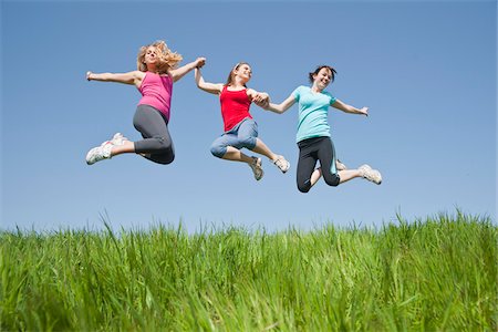 simsearch:700-06190615,k - Young Women Jumping Stock Photo - Premium Royalty-Free, Code: 600-03814756